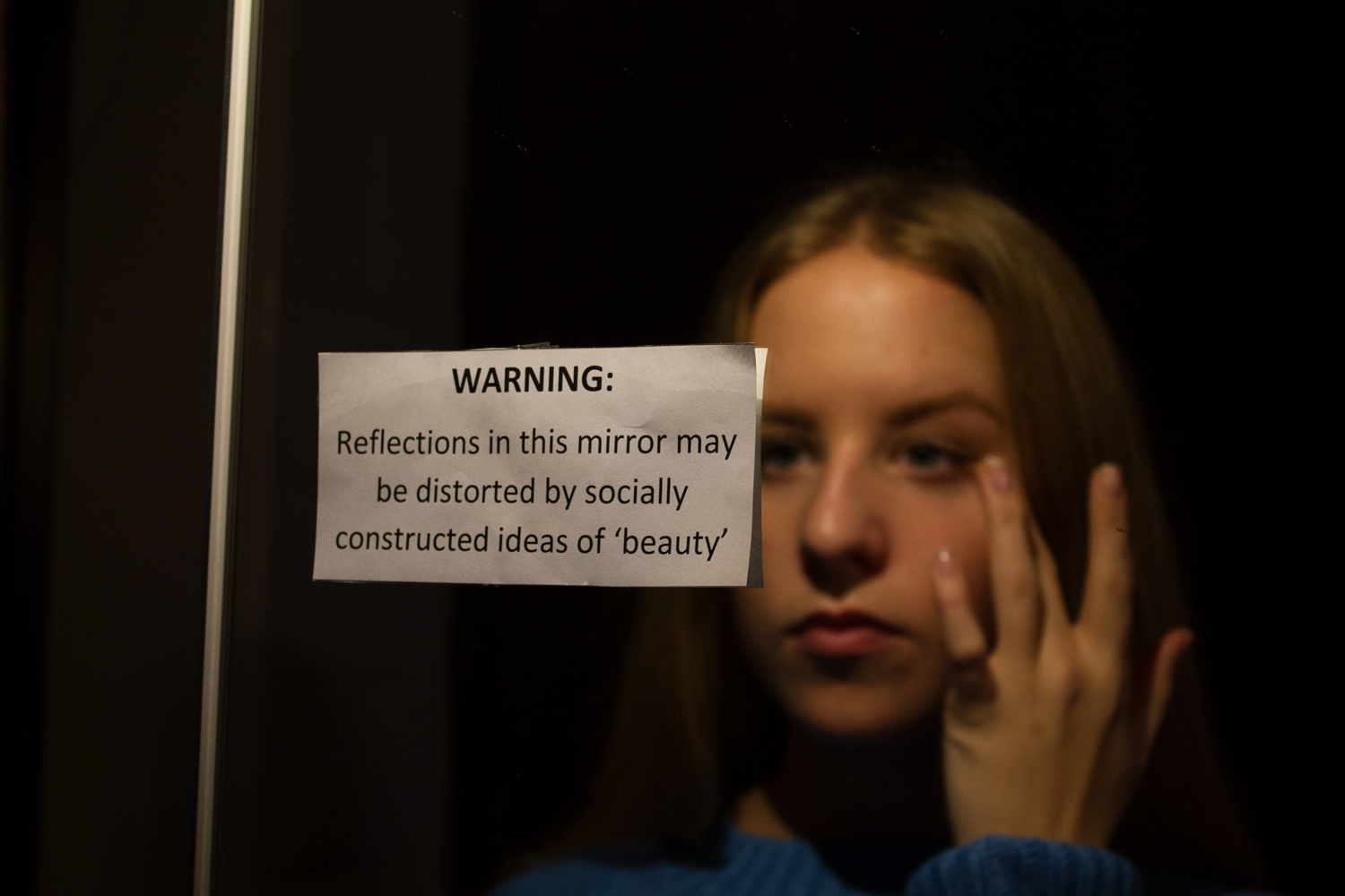 girl looking in mirror